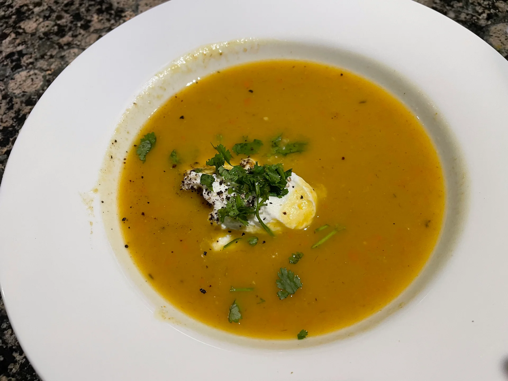 Pumpkin soup in a white bowl