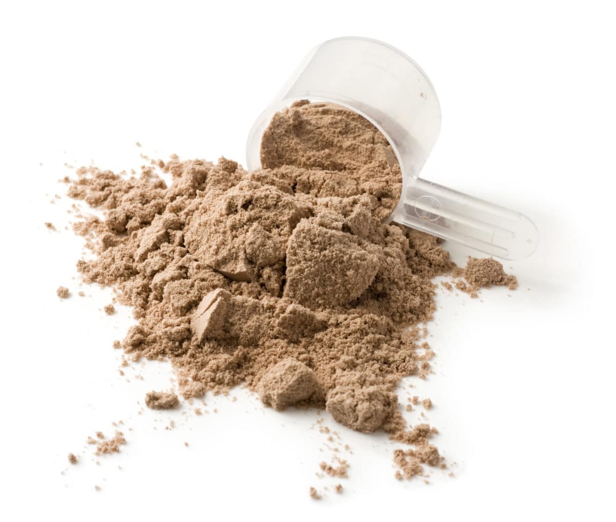 Brown insect powder in a clear measuring scoop on a white surface.