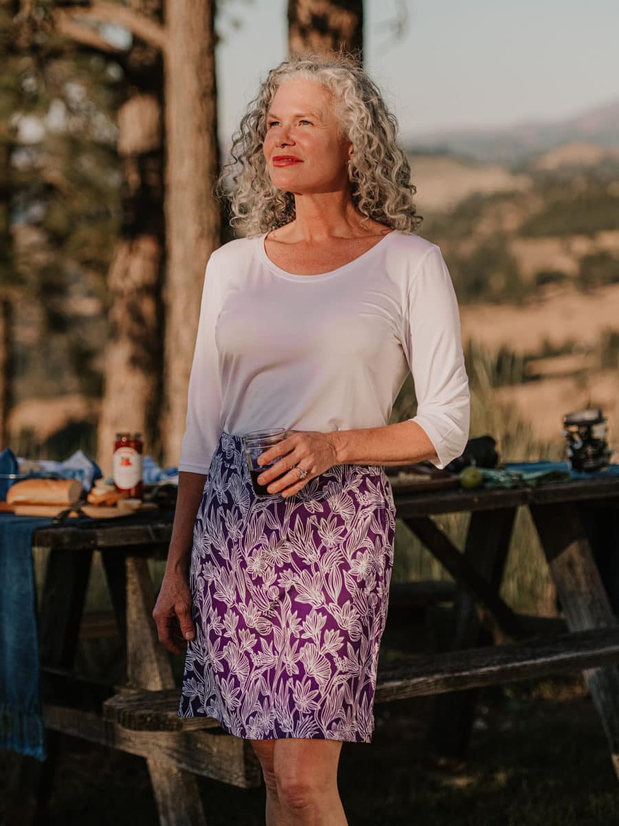 Mature woman in nature wearing a RipSkirt outfit