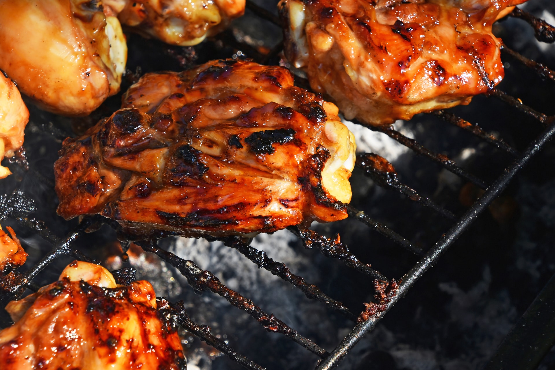 BBQ chicken roasting on a grill