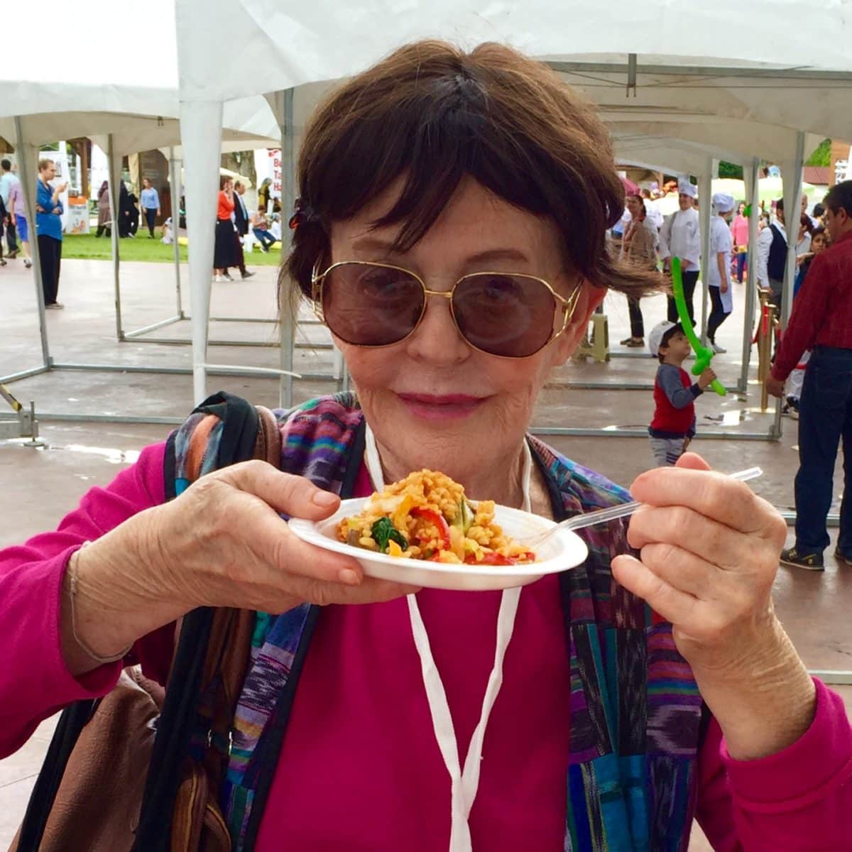 Barbara Hansen enjoying a meal at an outdoor event in Turkey.