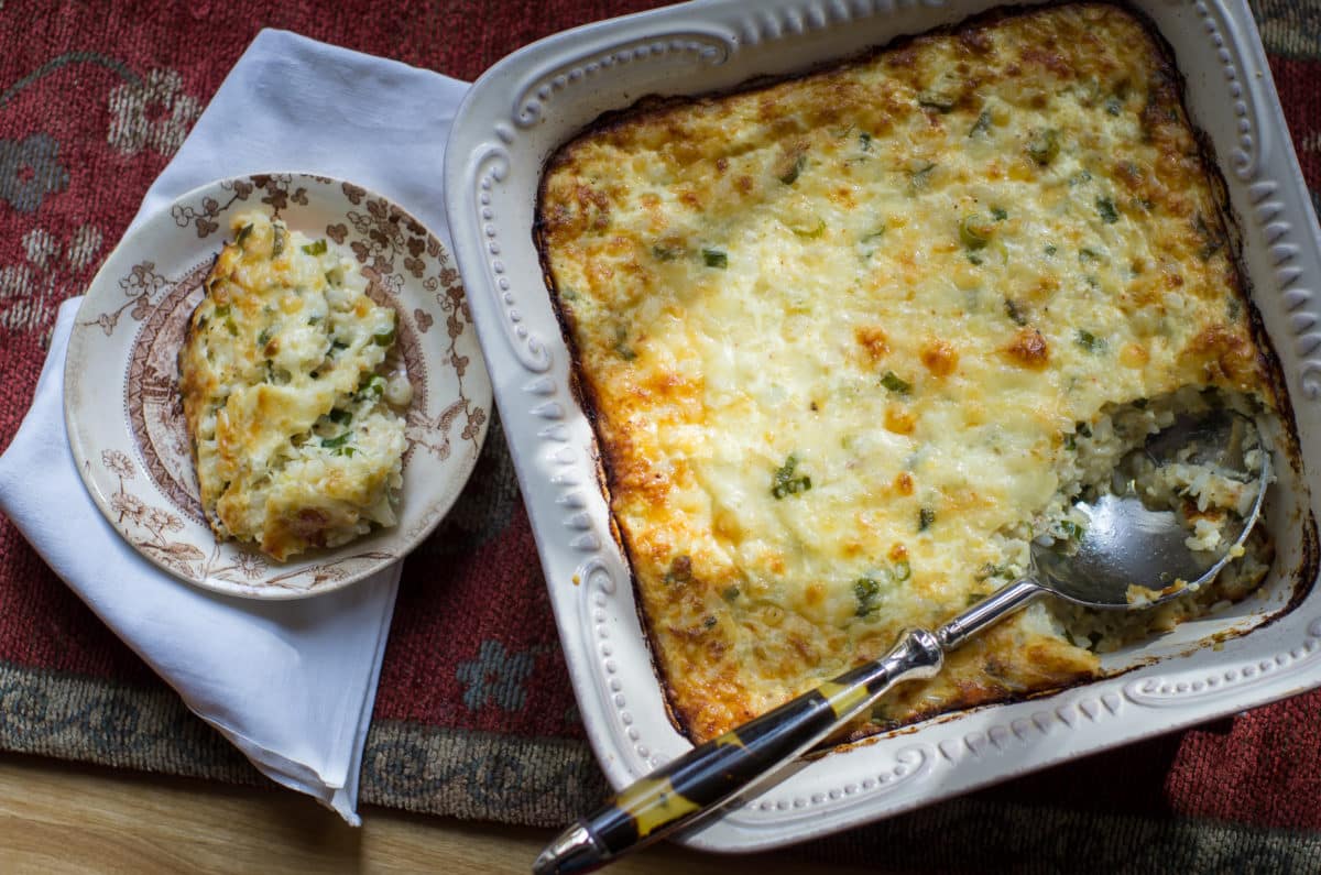 Delicious cheesy rice spoon bread on a plate