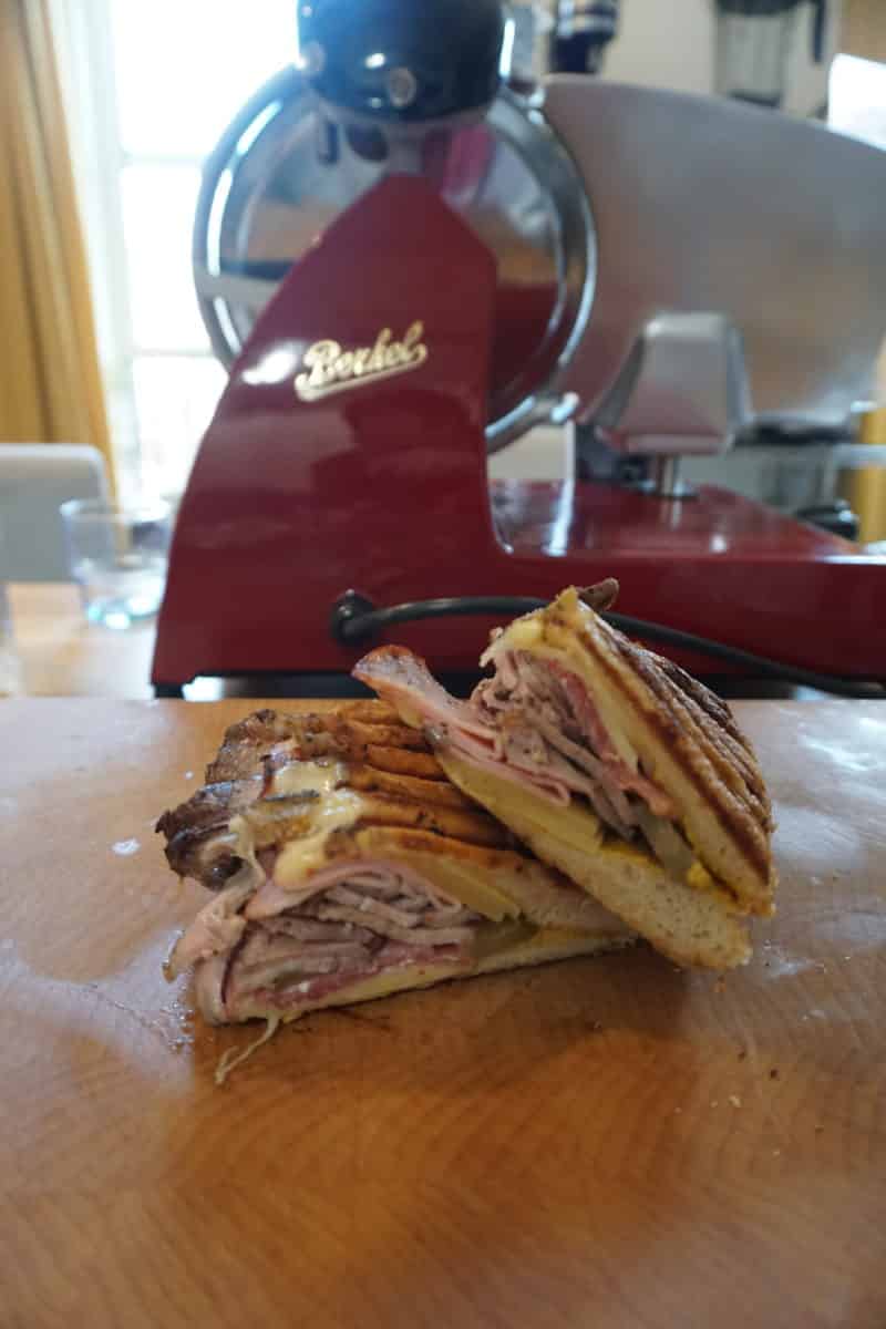 Close-up of a Cubano sandwich press with the sandwich inside.