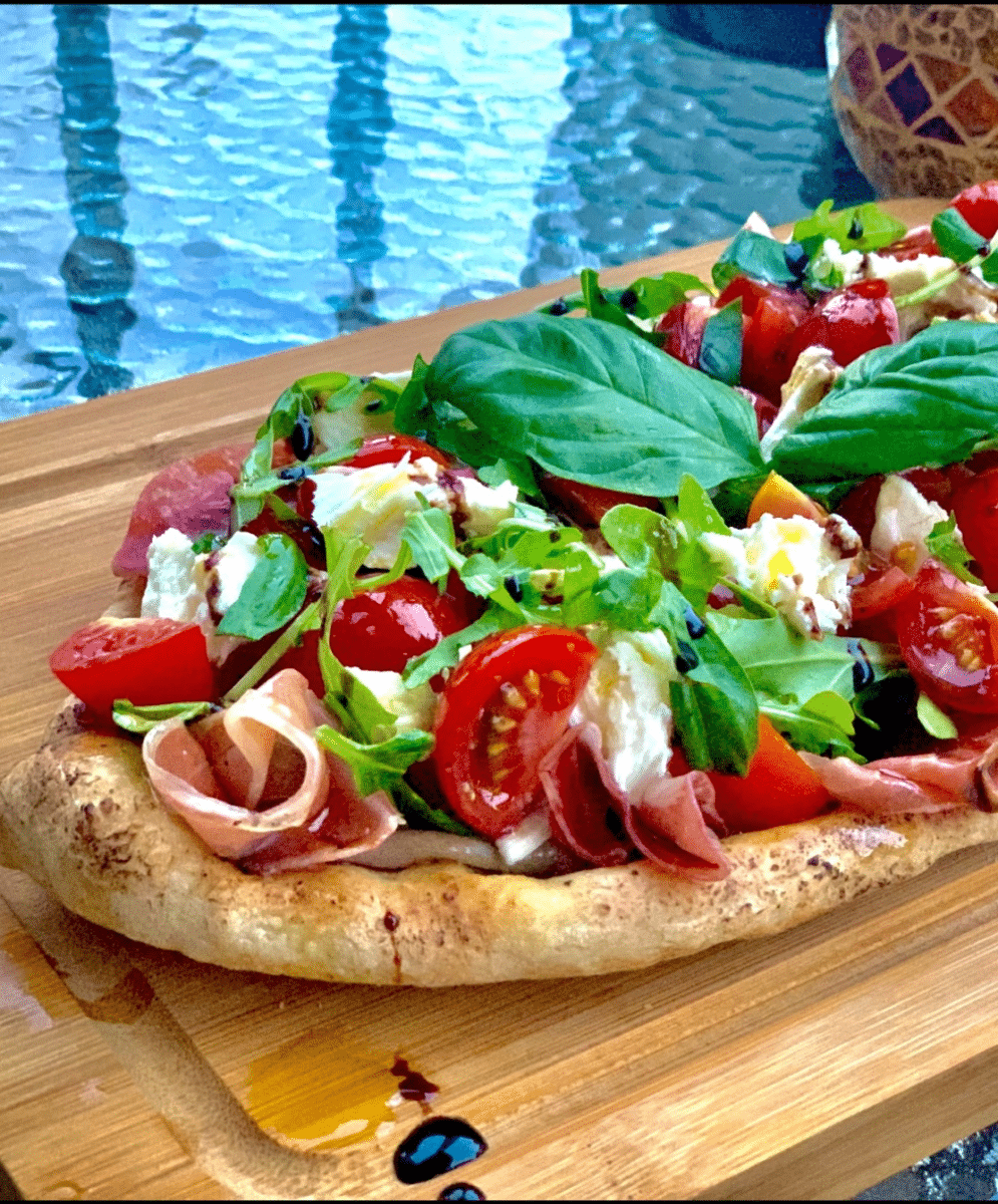 Fresh Italian snack with tomatoes, basil, and meat